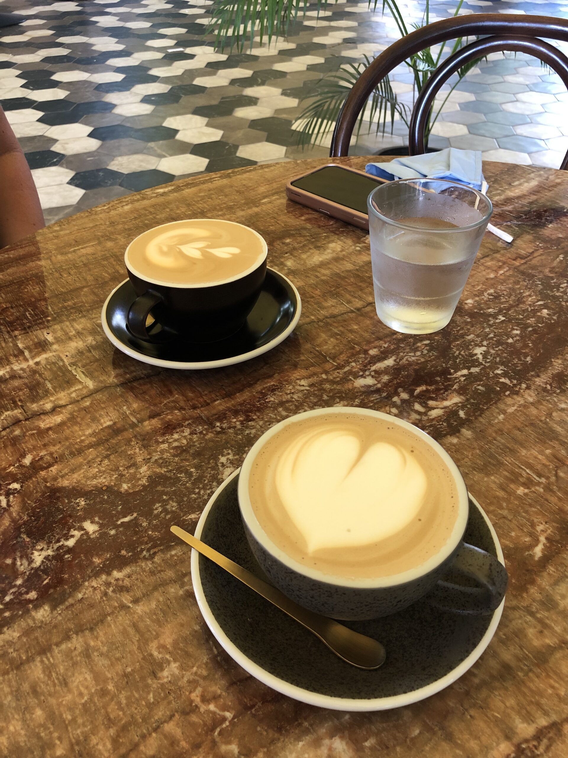 Two lattes with latte art at Brew Coffee Company