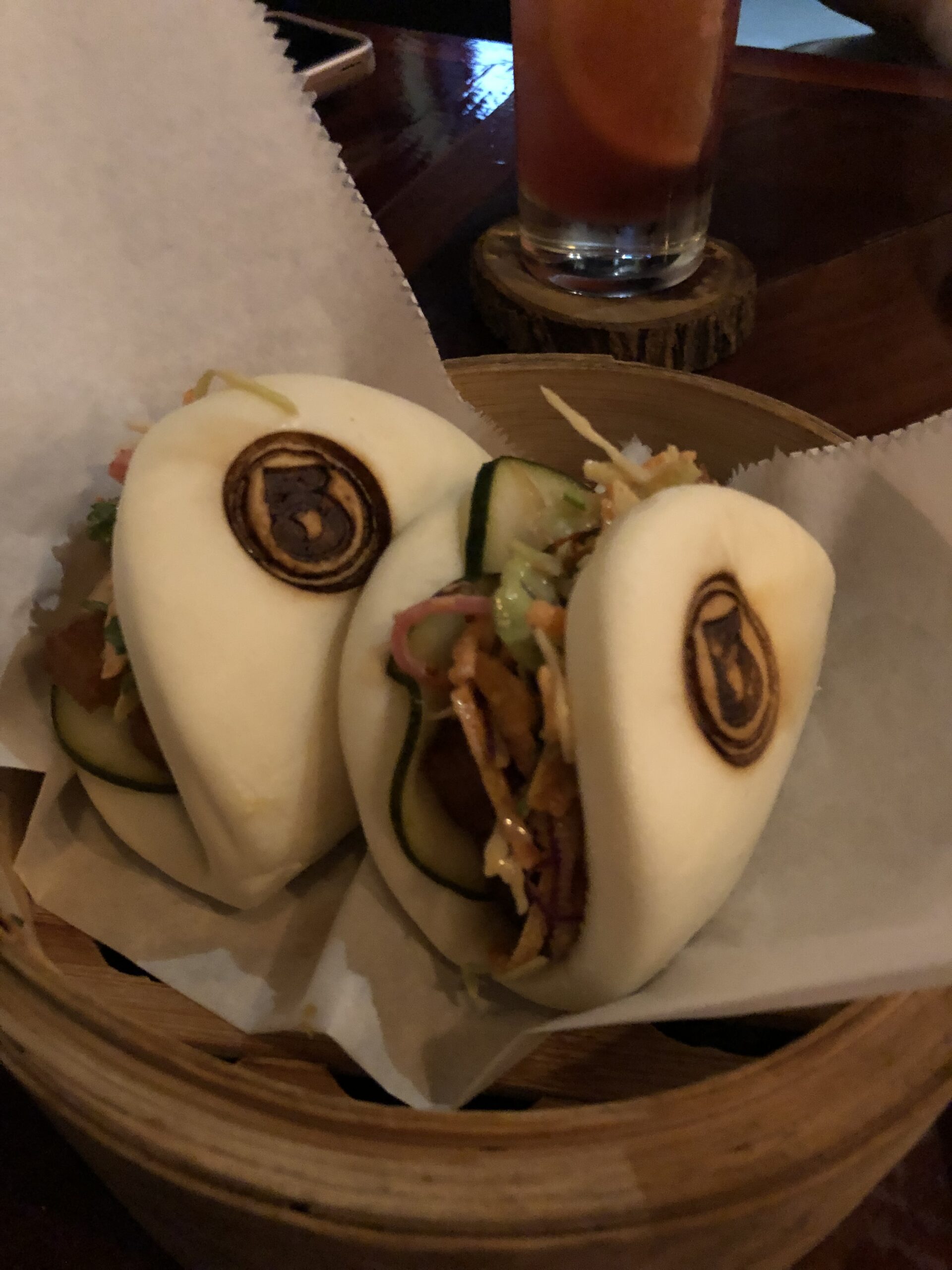 Steamed bao buns in bamboo steamer at 5inco