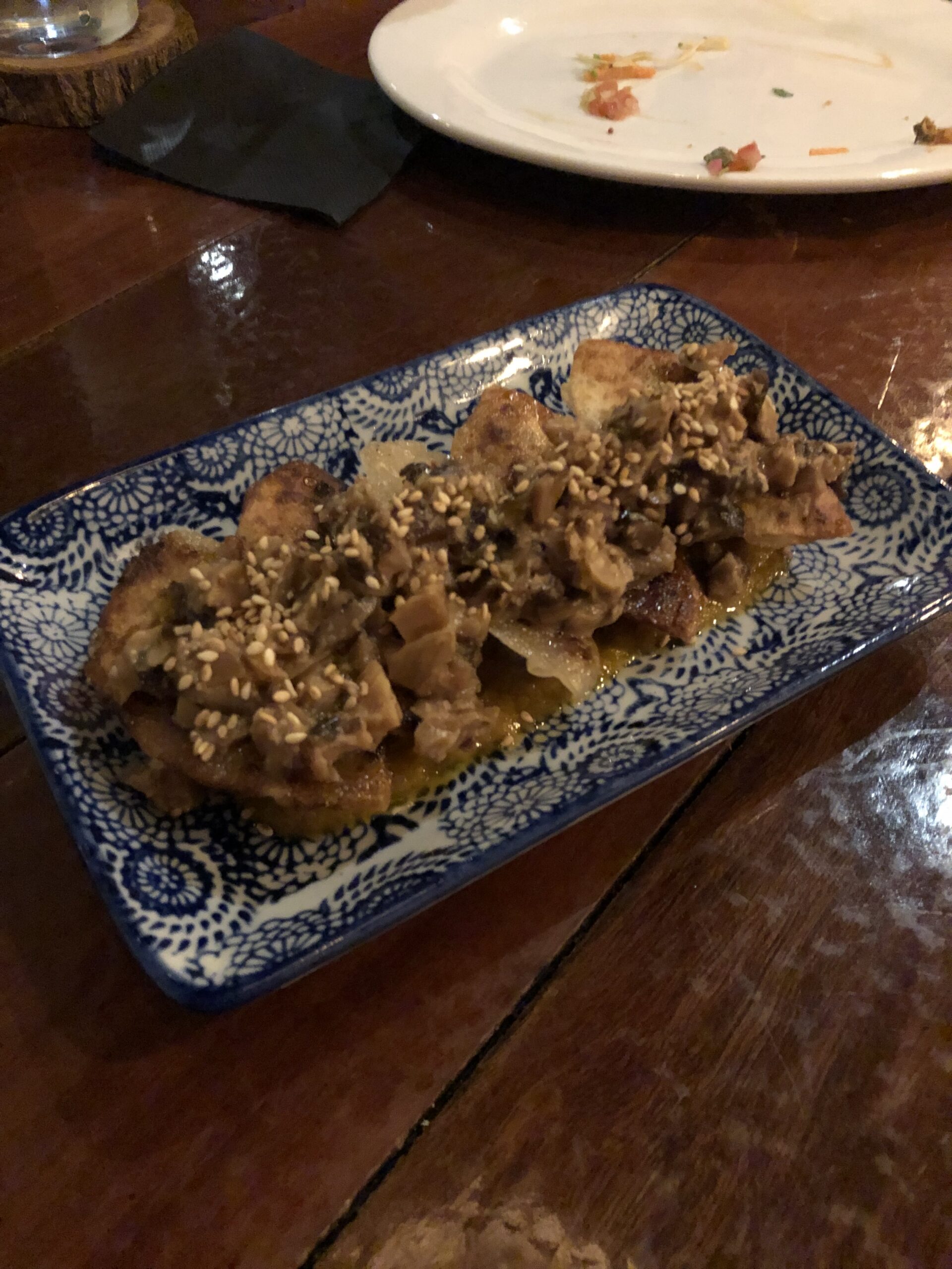 Pan-fried dumplings with sesame sauce at 5inco
